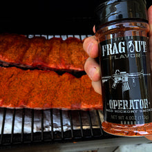 Operator seasoned beef ribs on smoker